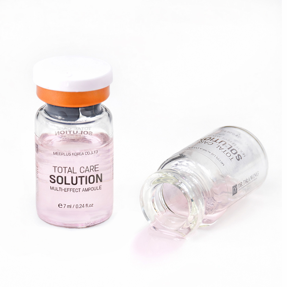 
                  
                    Two small clear glass ampoules containing pale pink liquid, one standing upright with a white cap and orange collar, and one lying on its side, on a white background. The upright bottle shows the text 'MOIUTUS' and 'TOTAL CARE SOLUTION MULTI-EFFECT AMPOULE'.
                  
                